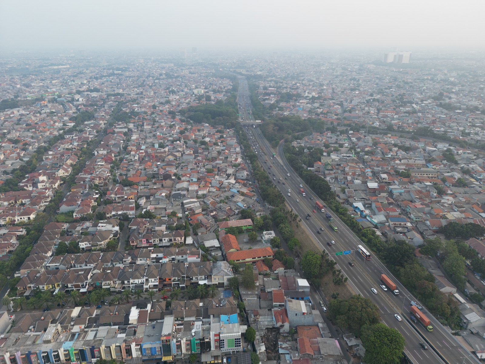 An aerial view of residential neighbourhoods and transport routes in West Bekasi, September 2023